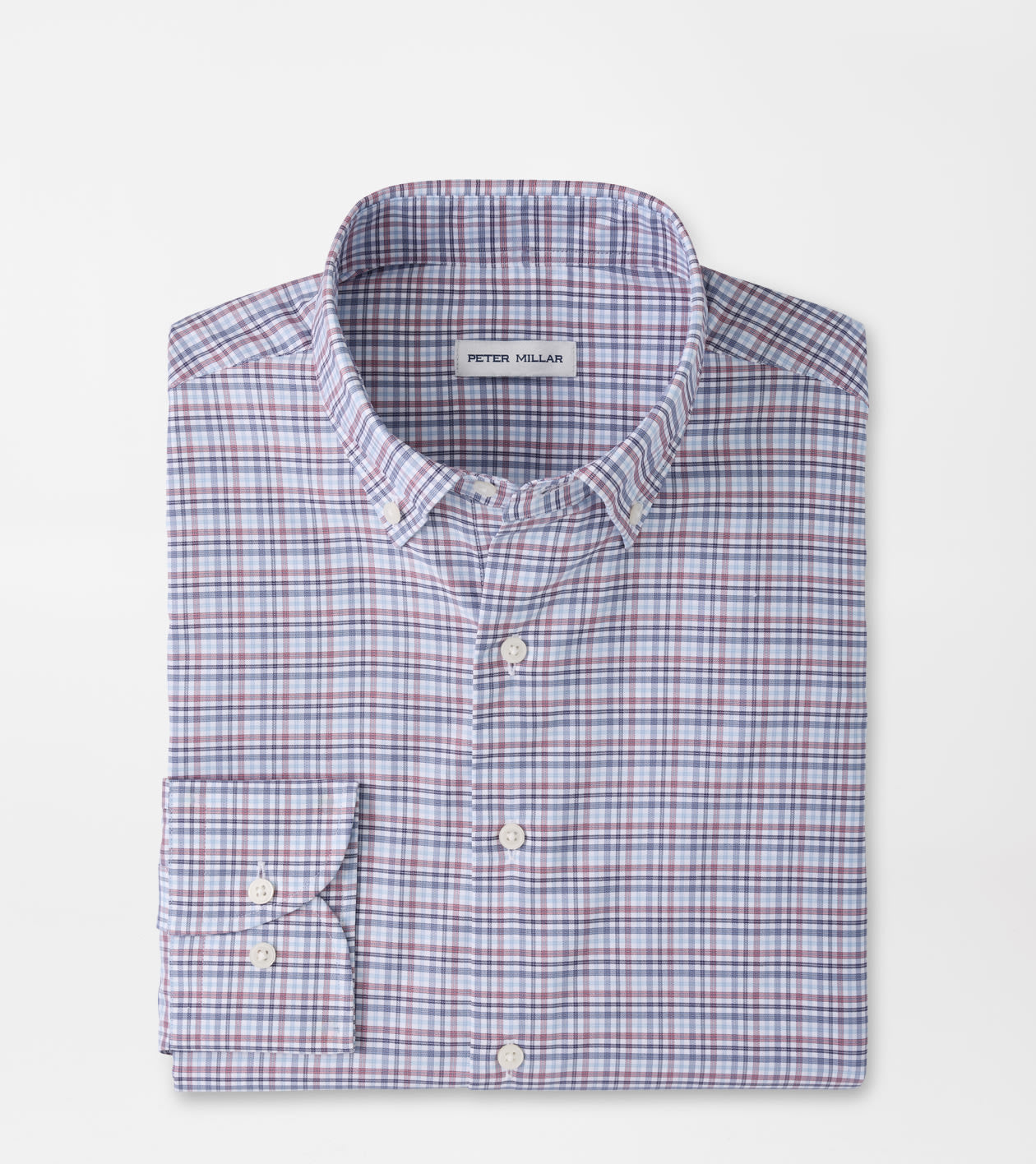 A folded Peter Millar long-sleeve button-down shirt with a fine red and blue check pattern on a white base, shown on a solid white background.