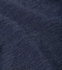 A close-up of dark navy blue woven fabric with a fine textured pattern.