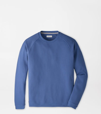 A blue crewneck sweatshirt with raglan sleeves, laid flat against a light gray background.