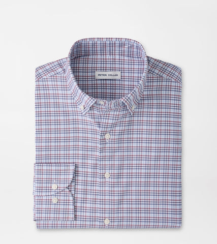 A folded Peter Millar long-sleeve button-down shirt with a fine red and blue check pattern on a white base, shown on a solid white background.